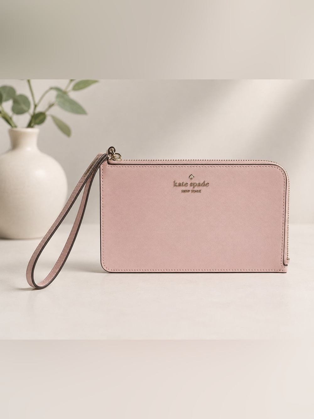 kate spade blush pink leather wristlet clutch with gold logo